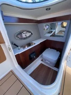 Slide: The Image of Interior of 2022 Chaparral 287 SSX with sink and toilet. - 7