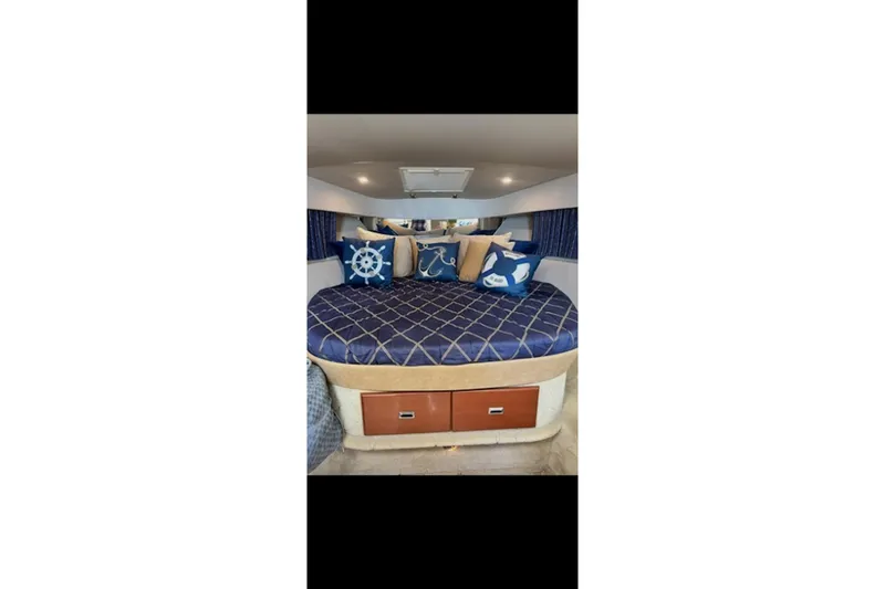 Slide: The Image of Interior of 2004 Formula 37 Performance Cruiser with nautical-themed bedding and pillows. - 12