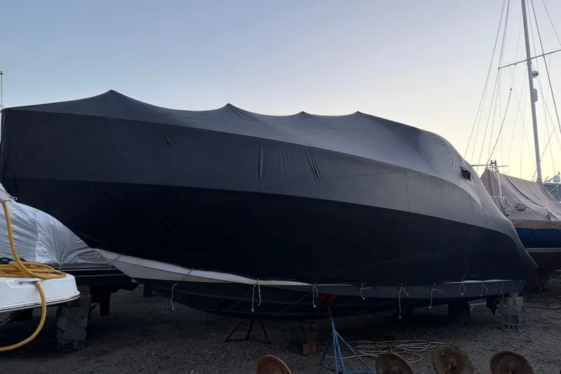 Slide: The Image of Covered 2004 Formula 37 Performance Cruiser on dry dock, ready for storage. - 17