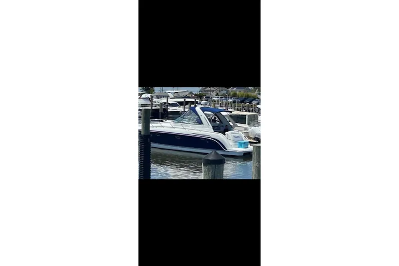 Slide: The Image of 2004 Formula 37 Performance Cruiser docked at marina, side view. - 4