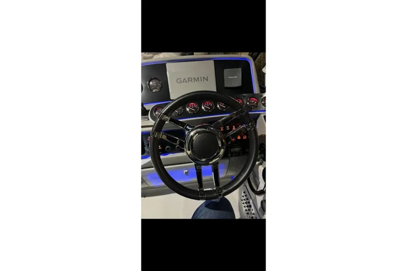 Slide: The Image of Steering wheel and dashboard of 2004 Formula 37 Performance Cruiser with Garmin navigation. - 6