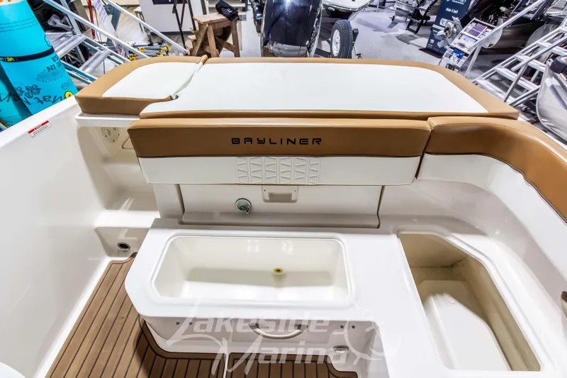 Slide: The Image of 2022 Bayliner VR5 Bowrider OB interior with seating and storage compartments. - 11