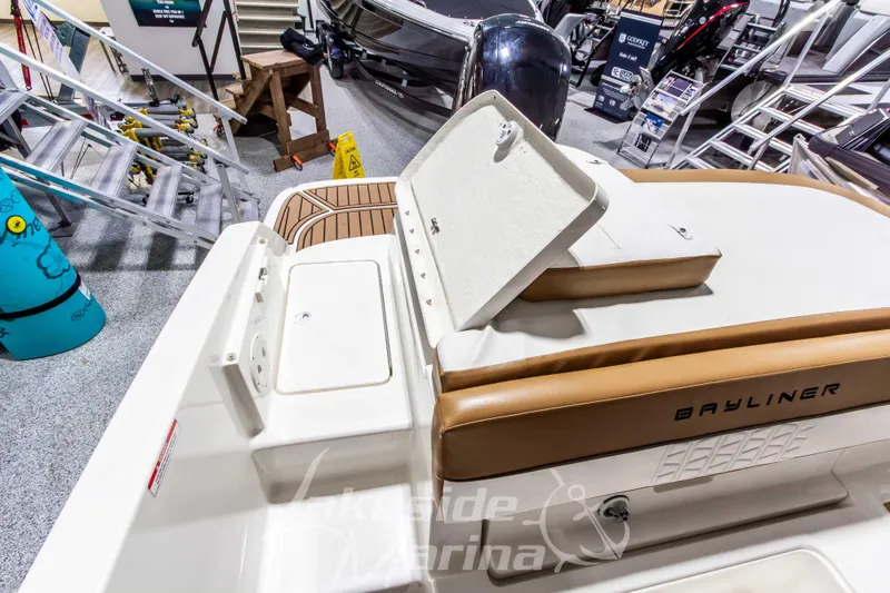 Slide: The Image of 2022 Bayliner VR5 Bowrider OB interior at a marina showroom. - 12