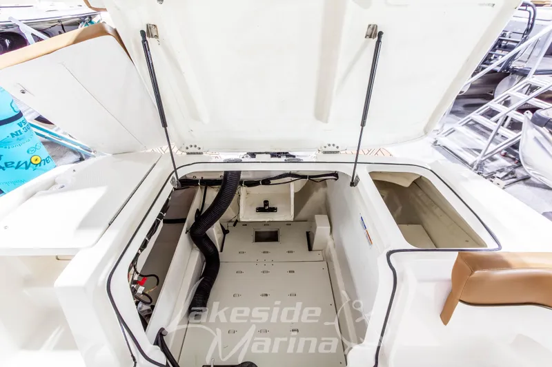 Slide: The Image of 2022 Bayliner VR5 Bowrider OB engine compartment with open hatch, showcasing interior details. - 14