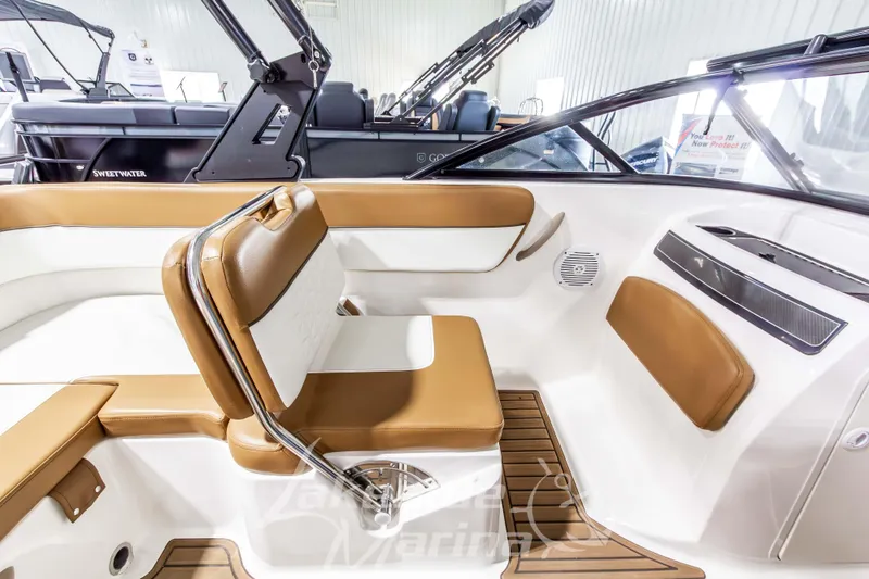Slide: The Image of 2022 Bayliner VR5 Bowrider OB interior with tan and white seating, modern design. - 20