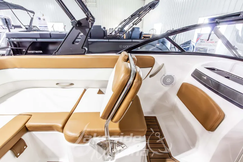 Slide: The Image of 2022 Bayliner VR5 Bowrider OB interior with tan and white seating, modern design. - 21
