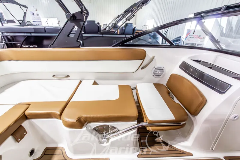 Slide: The Image of 2022 Bayliner VR5 Bowrider OB interior with tan and white seating, showcasing modern design. - 22