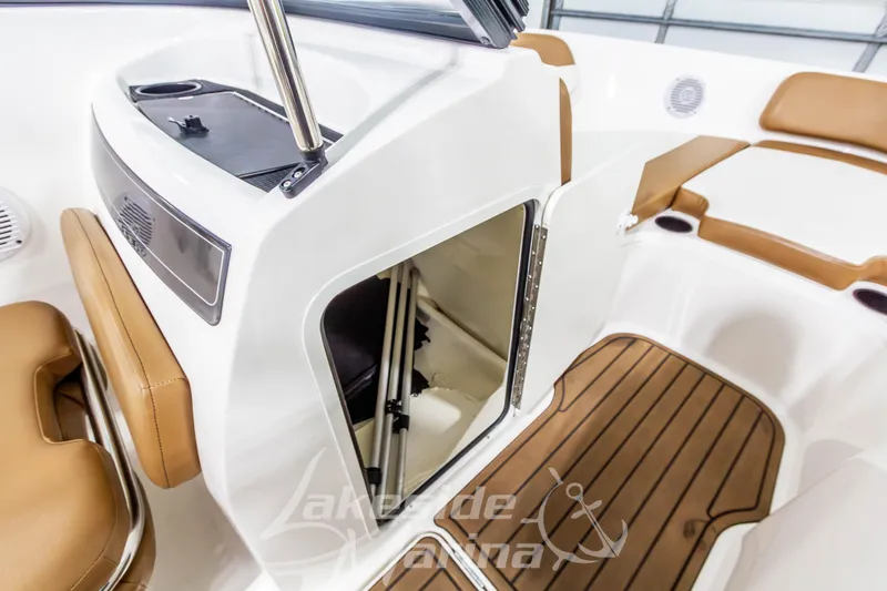 Slide: The Image of 2022 Bayliner VR5 Bowrider OB interior with storage compartment and cushioned seating. - 25