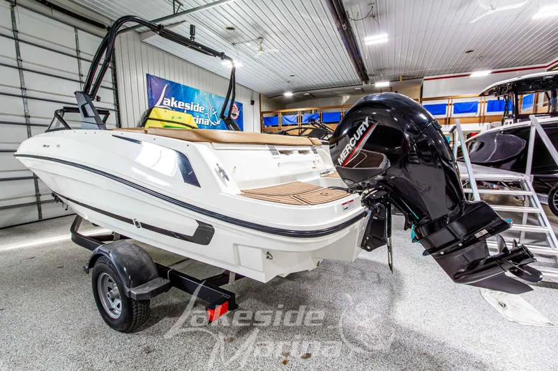 Slide: The Image of 2022 Bayliner VR5 Bowrider OB with Mercury outboard engine in showroom. - 3