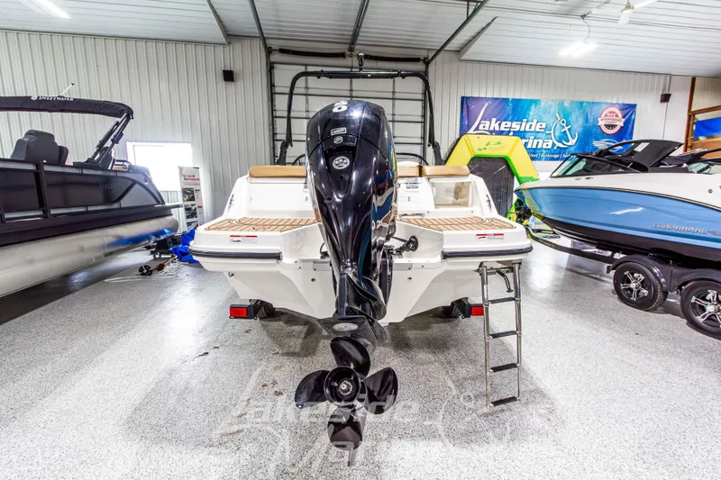 Slide: The Image of 2022 Bayliner VR5 Bowrider OB in showroom, rear view with outboard motor. - 4
