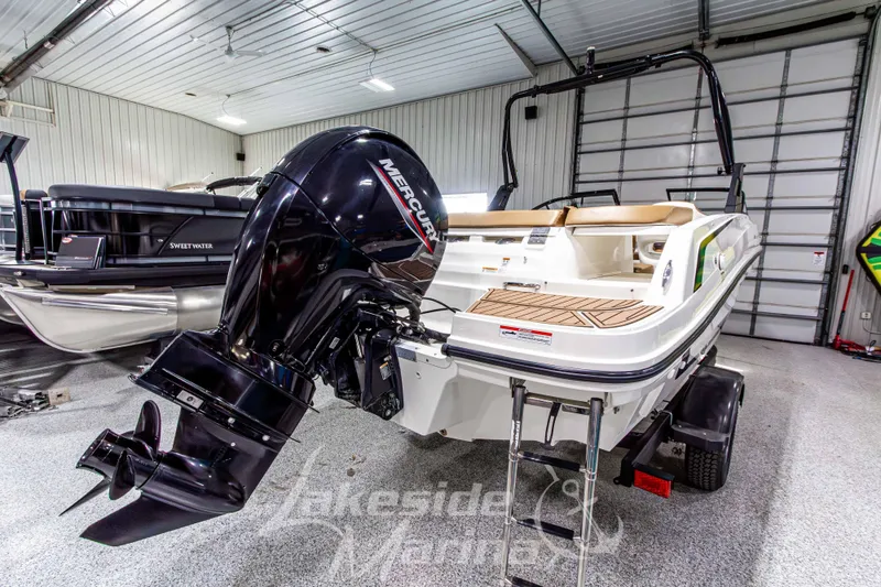 Slide: The Image of 2022 Bayliner VR5 Bowrider OB with Mercury outboard engine in showroom. - 5
