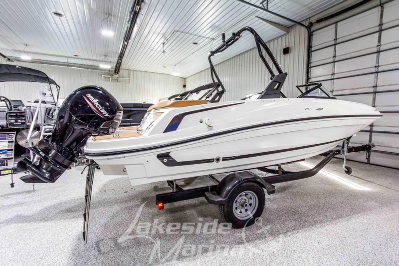 Slide: The Image of 2022 Bayliner VR5 Bowrider OB in showroom, featuring Mercury outboard engine. - 6