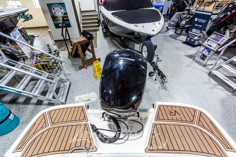 Slide: The Image of 2022 Bayliner VR5 Bowrider OB in showroom with Mercury outboard motor. - 8