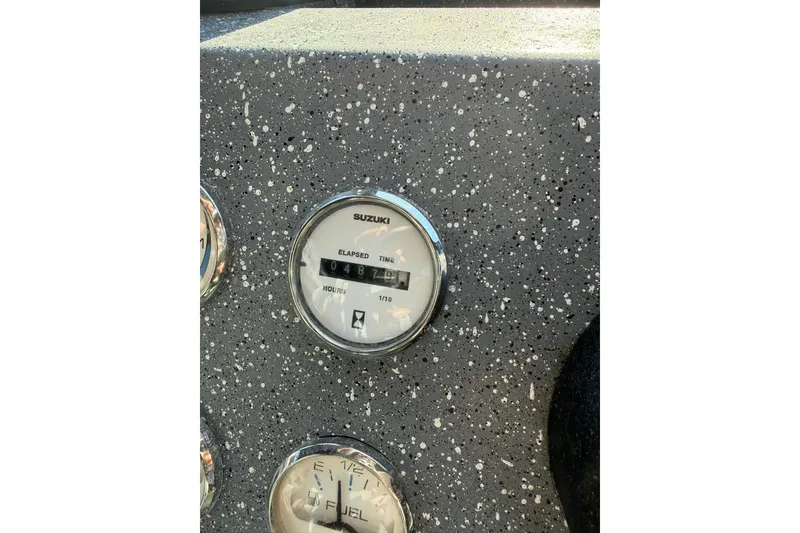 Slide: The Image of Gauge panel of 2016 Raider 182 Pro Sport boat, showing elapsed time and fuel levels. - 10