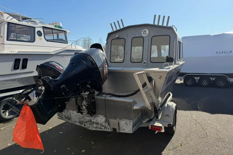 Slide: The Image of 2016 Raider 182 Pro Sport boat with Suzuki outboard motor on trailer. - 3