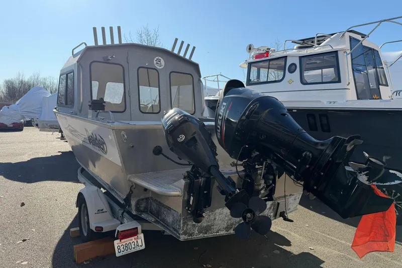 Slide: The Image of 2016 Raider 182 Pro Sport boat with Suzuki outboard motor on trailer. - 4