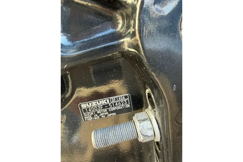 Slide: The Image of Close-up of Suzuki DF140A engine part on 2016 Raider 182 Pro Sport boat. - 6