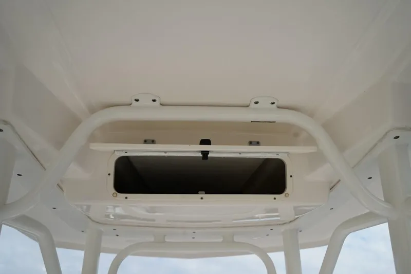 Slide: The Image of 2020 Robalo 226 Cayman boat storage compartment, open and empty. - 12