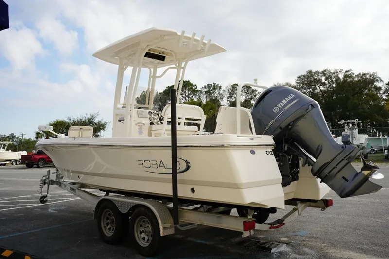 Slide: The Image of 2020 Robalo 226 Cayman boat on trailer with Yamaha outboard motor. - 18
