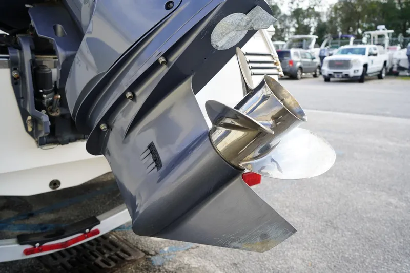 Slide: The Image of Propeller of 2020 Robalo 226 Cayman boat in a parking lot setting. - 5