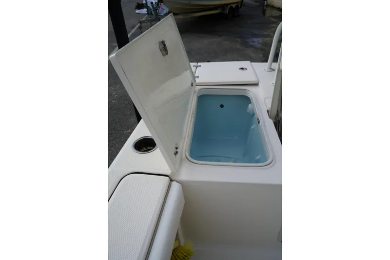 Slide: The Image of Open storage compartment on 2020 Robalo 226 Cayman boat deck. - 6