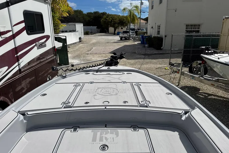 Slide: The Image of 2026 Yellowfin 24 Bay CE boat deck in a sunny outdoor setting. - 3