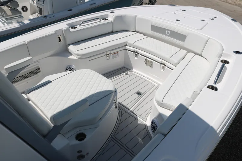 Slide: The Image of 2026 Sea Fox 282 Hybrid LT boat interior with white cushioned seating and sleek design. - 10