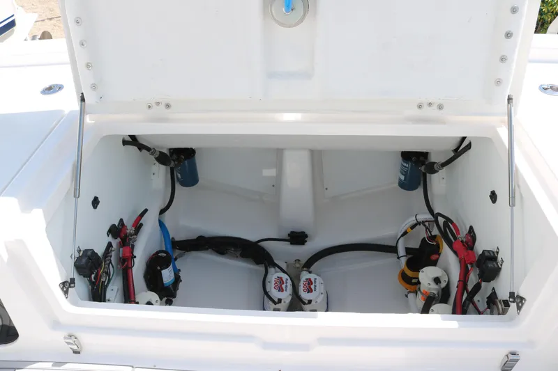 Slide: The Image of Open compartment of 2026 Sea Fox 282 Hybrid LT boat showing internal wiring and components. - 14