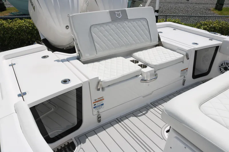 Slide: The Image of 2026 Sea Fox 282 Hybrid LT boat interior with white cushioned seating and storage compartments. - 15