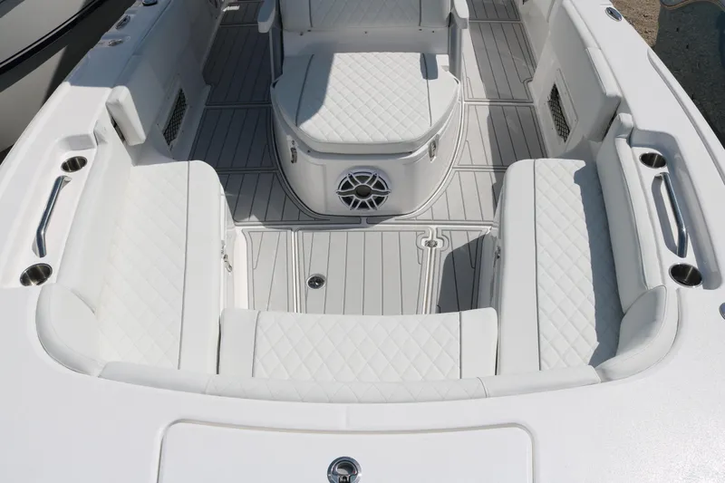 Slide: The Image of 2026 Sea Fox 282 Hybrid LT boat interior with white cushioned seating and sleek design. - 9