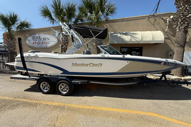 The Image of 2016 MasterCraft X46 boat on trailer at Boat Town dealership. - 1