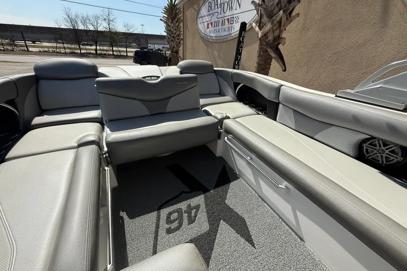 Slide: The Image of 2016 MasterCraft X46 boat interior with gray seating and carpeted floor. - 15