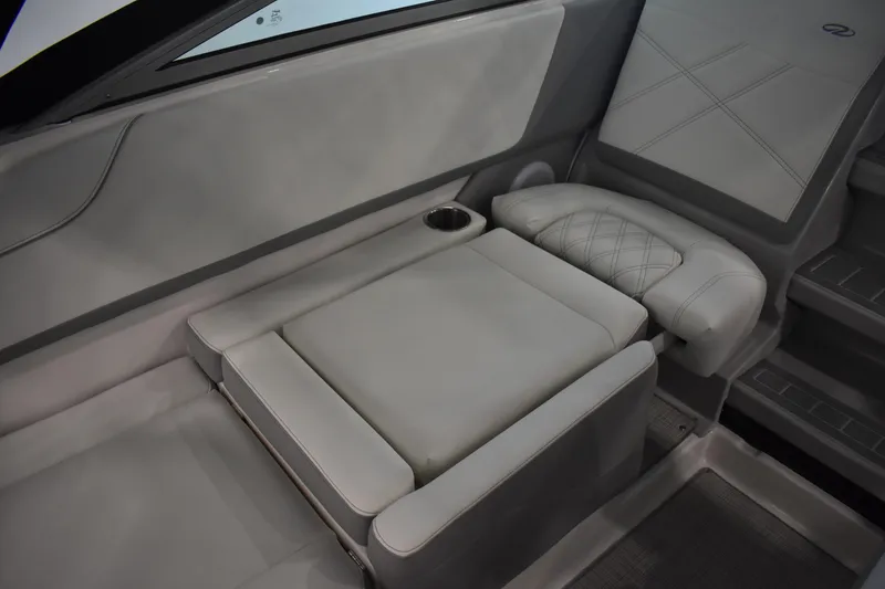 Slide: The Image of 2026 Regal 26 XO boat interior with luxurious seating and cup holder. - 14