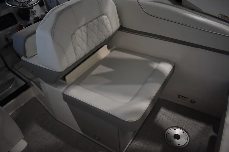 Slide: The Image of 2026 Regal 26 XO boat interior with cushioned seating and modern design. - 17