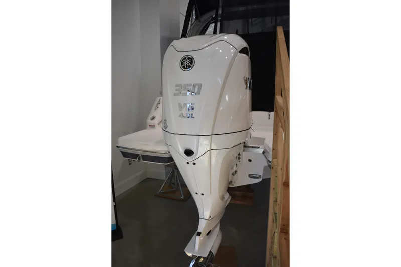 Slide: The Image of 2026 Regal 26 XO with Yamaha 350 V8 outboard motor in showroom display. - 2