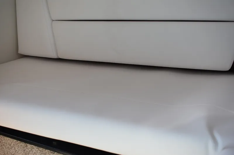 Slide: The Image of 2026 Regal 26 XO boat interior with white cushioned seating. - 34