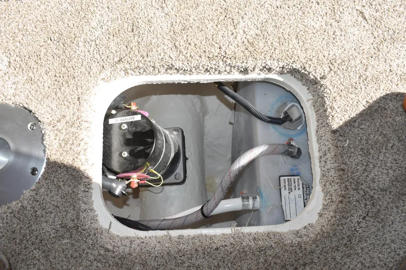 Slide: The Image of Access hatch in 2026 Regal 26 XO boat, showing internal wiring and components. - 36