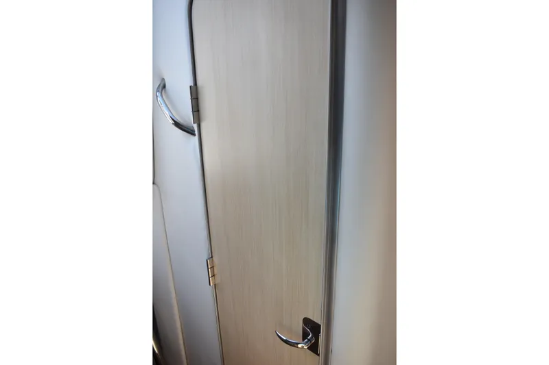 Slide: The Image of 2026 Regal 26 XO cabin door with sleek handle and modern design. - 45