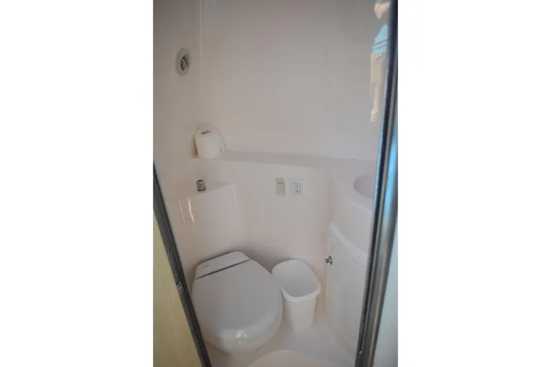 Slide: The Image of 2026 Regal 26 XO boat bathroom interior with toilet and compact design. - 46