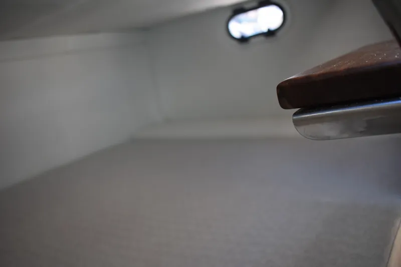 Slide: The Image of 2026 Regal 26 XO cabin interior with window and seating area. - 49