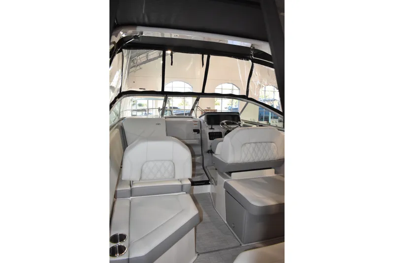 Slide: The Image of Interior of 2026 Regal 26 XO boat with modern seating and steering area. - 5