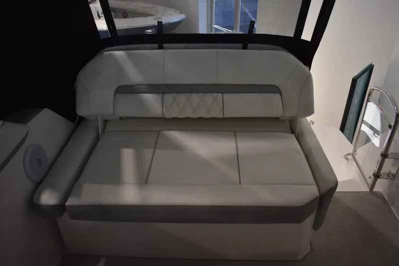 Slide: The Image of 2026 Regal 26 XO boat interior with cushioned seating and modern design. - 7
