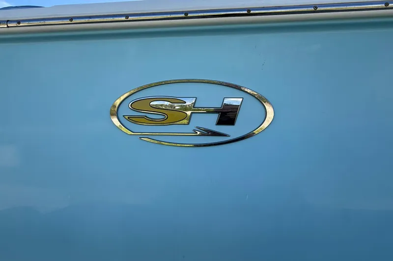 Slide: The Image of 2018 Sea Hunt Gamefish 27 logo on light blue boat exterior. - 22