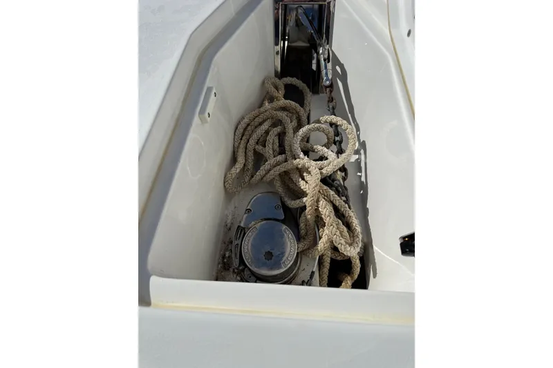 Slide: The Image of Anchor locker of 2018 Sea Hunt Gamefish 27 with ropes and winch. - 30