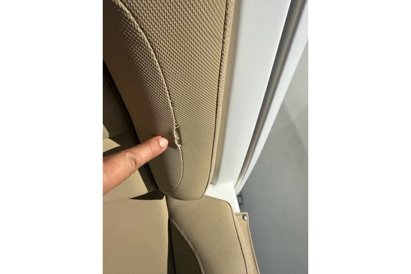 Slide: The Image of Close-up of a 2018 Sea Hunt Gamefish 27 seat with a small tear. - 31