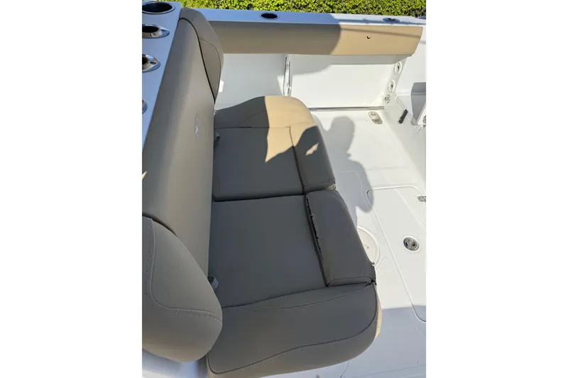 Slide: The Image of 2018 Sea Hunt Gamefish 27 boat interior with cushioned seating. - 32