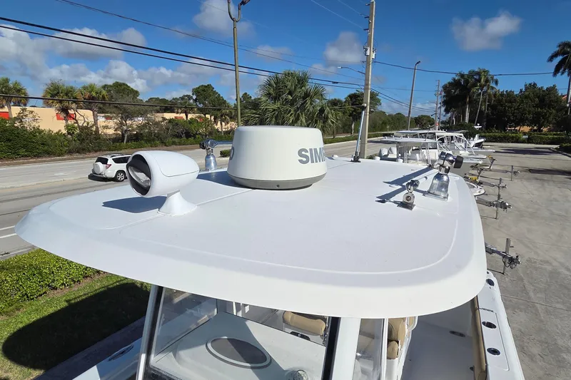 Slide: The Image of 2018 Sea Hunt Gamefish 27 boat with radar and navigation equipment on deck. - 37