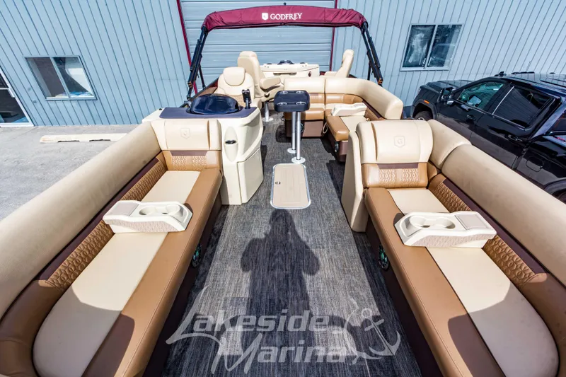 Slide: The Image of 2023 Godfrey Sweetwater 2286 FS pontoon boat interior with luxurious seating and modern design. - 10