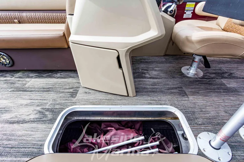 Slide: The Image of Interior of 2023 Godfrey Sweetwater 2286 FS boat with storage compartment open. - 17