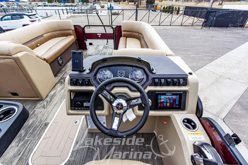 Slide: The Image of 2023 Godfrey Sweetwater 2286 FS boat interior with steering wheel and dashboard controls. - 20